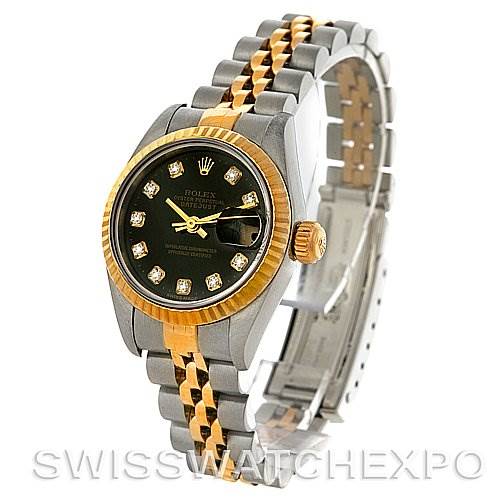The image shows a Rolex Datejust 79173 Women's Stainless Steel Black Dial 79173 Women's Stainless Steel Black Dial watch at a slanted angle, highlighting the gold and silver jubilee bracelet, black diamond-set dial, and fluted bezel.