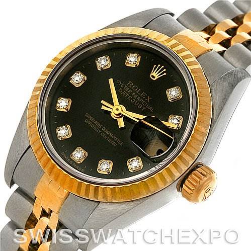 The image shows a Rolex Datejust 79173 Women's Stainless Steel Black Dial 79173 Women's Stainless Steel Black Dial watch from an oblique angle, highlighting its bezel, dial, and a portion of the bracelet and crown.