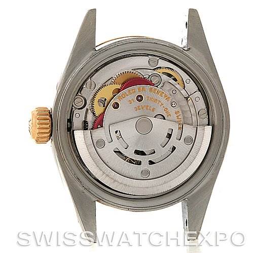 The image shows the back view of a Rolex Datejust 79173 Women's Stainless Steel Black Dial 79173 Women's Stainless Steel Black Dial watch, highlighting its internal movement and mechanism.