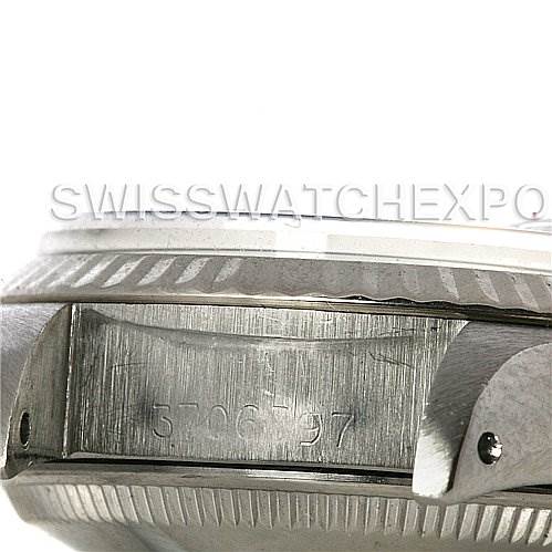 The image shows a close-up angle of the side case of a Rolex Datejust 6917 Women
s Stainless Steel Silver Dial 6917 Women
s Stainless Steel Silver Dial watch, highlighting the serial number engraving.