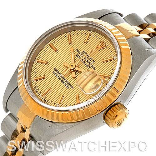 The image shows a Rolex Datejust 69173 Women's Stainless Steel Champagne Dial 69173 Women's Stainless Steel Champagne Dial watch at an angled side view, featuring the gold dial, fluted bezel, and part of the bracelet.