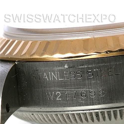This image shows a close-up of the side view of a Rolex Datejust 69173 Women's Stainless Steel Champagne Dial 69173 Women's Stainless Steel Champagne Dial watch, focusing on the stainless steel case and serial number.