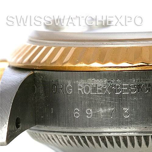 This close-up image shows the side of a Rolex Datejust 69173 Women's Stainless Steel Champagne Dial 69173 Women's Stainless Steel Champagne Dial watch with the bezel and serial number.