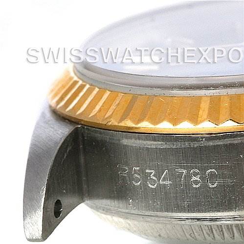 The image shows a close-up side view of the case, bezel, and part of the serial number of a Rolex Datejust 69173 Women's Stainless Steel Black Dial 69173 Women's Stainless Steel Black Dial watch.