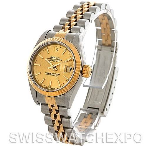 This image shows the Rolex Datejust 79173 Women's Stainless Steel Champagne Dial 79173 Women's Stainless Steel Champagne Dial watch from a three-quarter angle, highlighting the face, bezel, and metal bracelet.