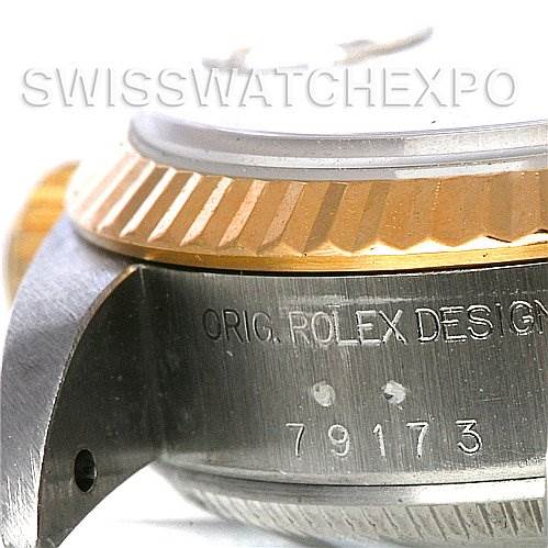 This image shows a close-up side view of the case and bezel of a Rolex Datejust 79173 Women's Stainless Steel Champagne Dial 79173 Women's Stainless Steel Champagne Dial watch, displaying part of the serial number.