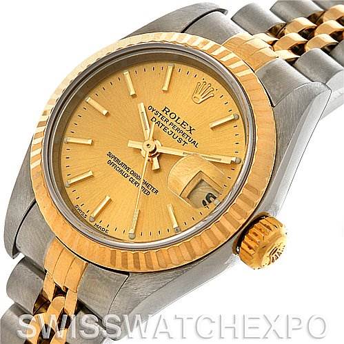 This image shows a close-up angle of a Rolex Datejust 79173 Women's Stainless Steel Champagne Dial 79173 Women's Stainless Steel Champagne Dial watch, highlighting the gold dial, bezel, and crown, along with its two-tone bracelet.