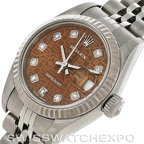 The image shows a Rolex Datejust 79174 Women's Stainless Steel Brown Dial 79174 Women's Stainless Steel Brown Dial watch from an angled view, highlighting the dial, bezel, case, crown, and part of the bracelet.