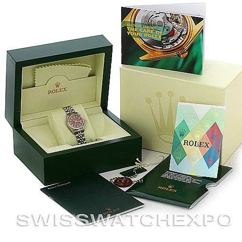 The image shows a Rolex Datejust 79174 Women's Stainless Steel Brown Dial 79174 Women's Stainless Steel Brown Dial watch in its box, alongside manuals, a warranty card, and watch tags.