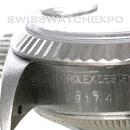 This image shows a close-up angle of the case side and bezel of a Rolex Datejust 69174 Women's Stainless Steel Pink Dial 69174 Women's Stainless Steel Pink Dial watch.