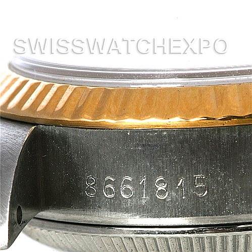 This image shows a close-up view of the side of a Rolex Datejust 69173 Women's Stainless Steel White Dial 69173 Women's Stainless Steel White Dial watch, highlighting the serial number and part of the fluted bezel.