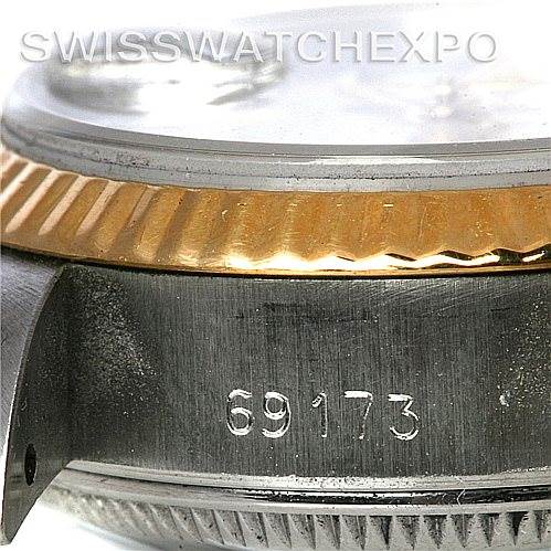 The image shows a close-up of the side of a Rolex Datejust 69173 Women's Stainless Steel White Dial 69173 Women's Stainless Steel White Dial watch, including the bezel, case, and reference number 69173.