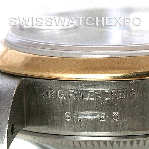 This image shows a close-up side view of a Rolex Datejust 69163 Women's Stainless Steel Grey Dial 69163 Women's Stainless Steel Grey Dial watch, specifically the bezel and the engraved serial number.