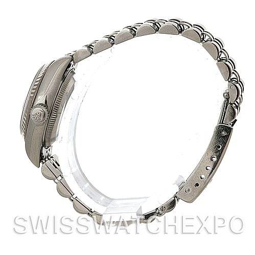 The image shows a side view of a Rolex Datejust 79174 Women's Stainless Steel White Dial 79174 Women's Stainless Steel White Dial watch, displaying the case, bezel, crown, and bracelet.