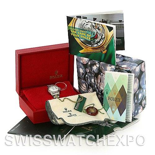 The Rolex Datejust 79174 Women's Stainless Steel White Dial 79174 Women's Stainless Steel White Dial watch is displayed with its box, manuals, and accessories, including a polishing cloth and tags.