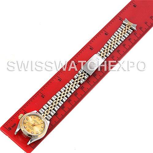 The image shows a Rolex Datejust 69173 Women's Stainless Steel Champagne Dial 69173 Women's Stainless Steel Champagne Dial watch laid flat, displaying the full bracelet and the face of the watch next to a red ruler.