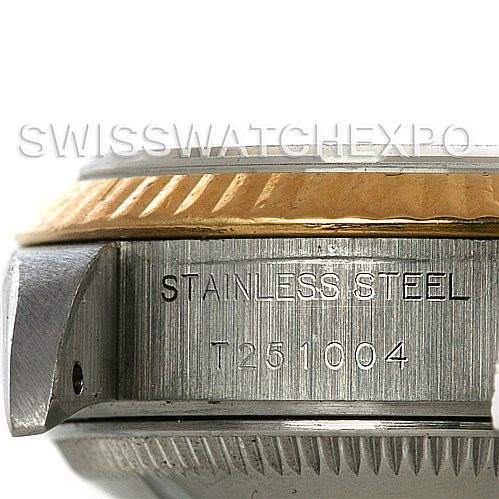 The image shows a close-up side view of the case and bezel of a Rolex Datejust 69173 Women's Stainless Steel White Dial 69173 Women's Stainless Steel White Dial, with "STAINLESS STEEL" and a serial number engraved.