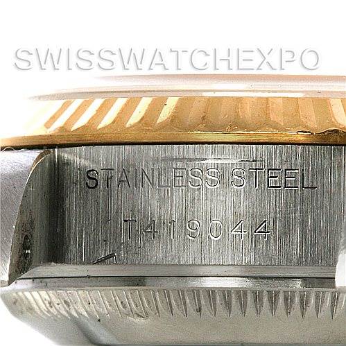 This image shows a close-up of the side of a Rolex Datejust 69173 Women's Stainless Steel White Dial 69173 Women's Stainless Steel White Dial watch, highlighting the stainless steel engraving and part of the gold bezel.