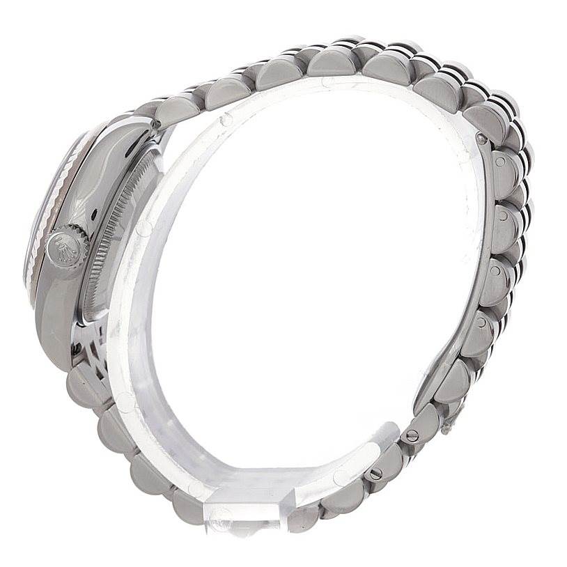 The image shows a side angle of the Rolex Datejust 179174 Women's Stainless Steel Pink Dial 179174 Women's Stainless Steel Pink Dial watch, focusing on the case, crown, and bracelet.