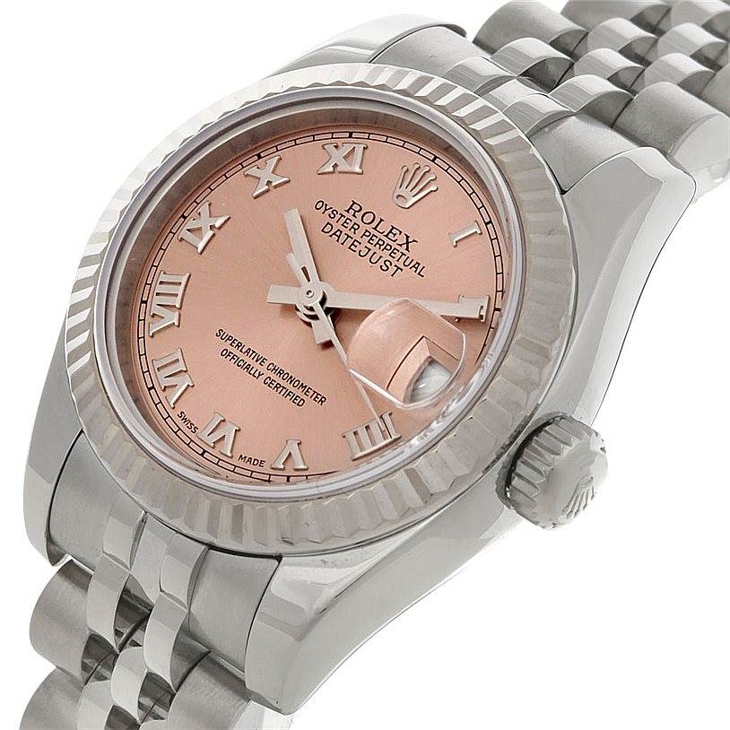 The Rolex Datejust 179174 Women's Stainless Steel Pink Dial 179174 Women's Stainless Steel Pink Dial watch is shown at a slight angle, displaying the face, bezel, crown, and part of the bracelet.