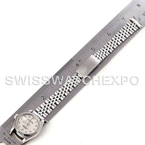 This image shows a top-down view of a Rolex Datejust 79174 Women's Stainless Steel Beige Dial 79174 Women's Stainless Steel Beige Dial model watch, including its face and metal bracelet being measured.