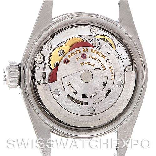 This image shows the back view of a Rolex Datejust 79174 Women's Stainless Steel Beige Dial 79174 Women's Stainless Steel Beige Dial watch, highlighting its internal movement and mechanical components.