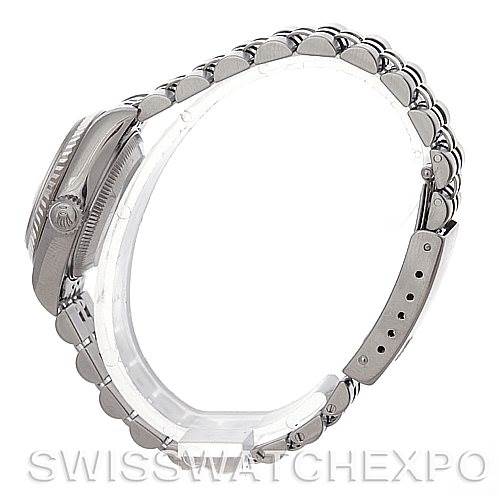 This image shows a side view of the Rolex Datejust 79174 Women's Stainless Steel Beige Dial 79174 Women's Stainless Steel Beige Dial watch, highlighting its case, bezel, and metal bracelet.