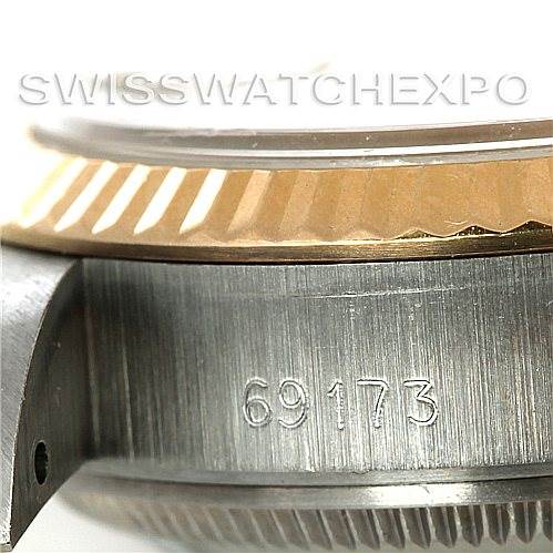 The image shows a close-up of the Rolex Datejust 69173 Women's Stainless Steel Champagne Dial 69173 Women's Stainless Steel Champagne Dial watch's side, focusing on the model number "69173" and the fluted bezel.