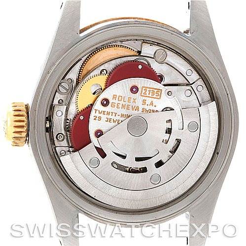 This image shows the internal mechanics of a Rolex Datejust 69173 Women's Stainless Steel Champagne Dial 69173 Women's Stainless Steel Champagne Dial watch, including the rotor, gears, and various components of the movement.