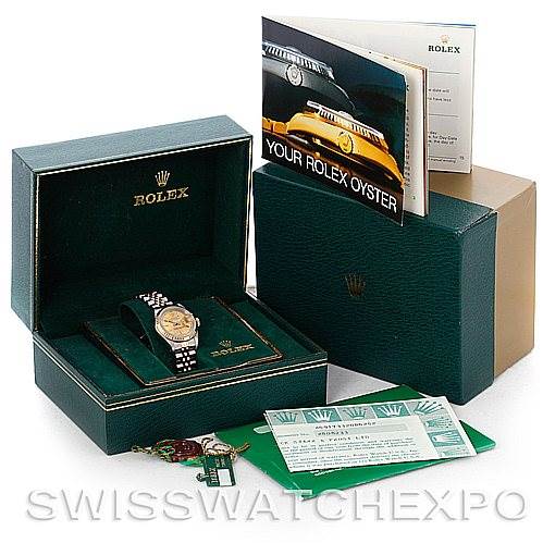 The image shows a Rolex Datejust 69173 Women's Stainless Steel Champagne Dial 69173 Women's Stainless Steel Champagne Dial model watch in its open box, accompanied by its warranty card, booklet, and tags.
