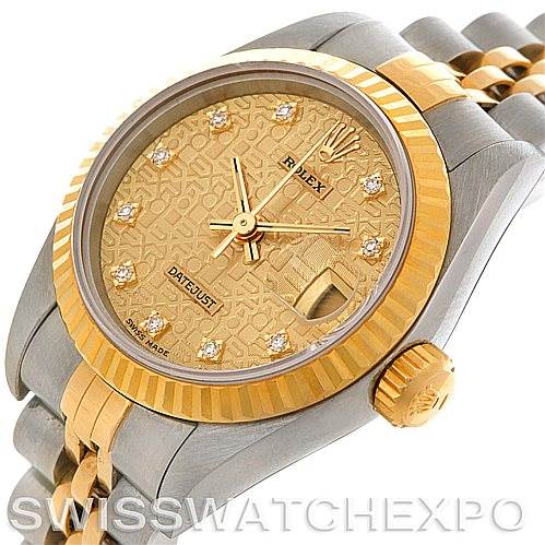This image shows the dial, bezel, crown, and part of the bracelet of the Rolex Datejust 69173 Women's Stainless Steel Champagne Dial 69173 Women's Stainless Steel Champagne Dial watch at an angled view.