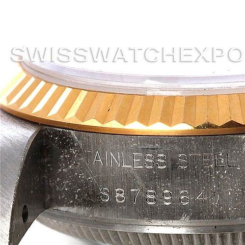 This image shows a close-up of the side of a Rolex Datejust 69173 Women's Stainless Steel Champagne Dial 69173 Women's Stainless Steel Champagne Dial watch, focusing on the stainless steel case and part of the fluted bezel.