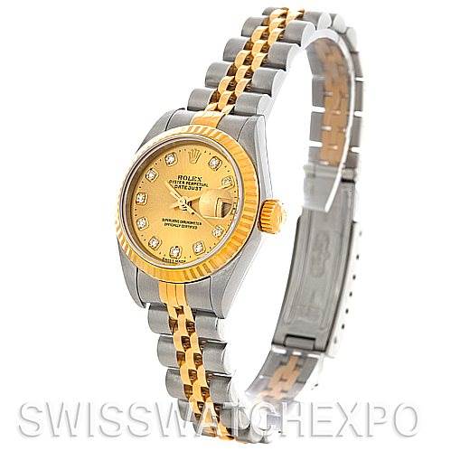 The image features a Rolex Datejust 79173 Women's Stainless Steel Champagne Dial 79173 Women's Stainless Steel Champagne Dial watch shown from a three-quarter angle, displaying its gold and silver bracelet, bezel, and diamond-accented dial.