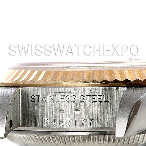 This image shows a close-up of the side of a Rolex Datejust 79173 Women's Stainless Steel Champagne Dial 79173 Women's Stainless Steel Champagne Dial watch, including the stainless steel case and the serial number.
