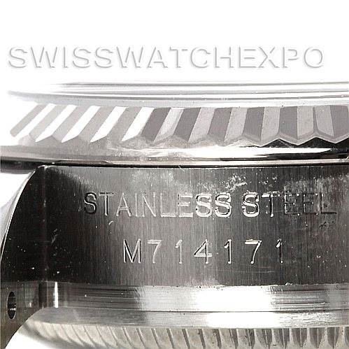 This image shows a close-up angle of the side of a Rolex Datejust 179174 Women's Stainless Steel Silver Dial 179174 Women's Stainless Steel Silver Dial watch, focusing on the serial number and "Stainless Steel" engraving.