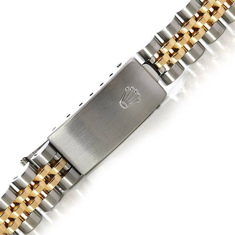 This image shows the clasp and bracelet of a Rolex Datejust 69173 Women's Stainless Steel White Dial 69173 Women's Stainless Steel White Dial watch, featuring a combination of gold and stainless steel links.