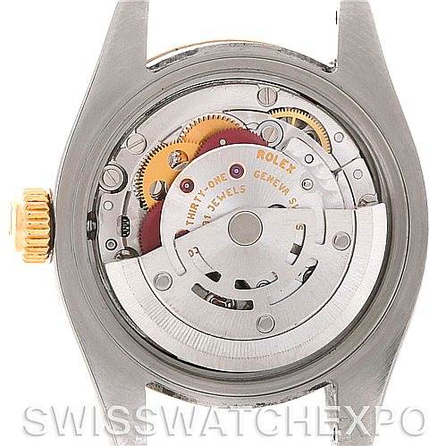 This image shows the internal mechanics of a Rolex Datejust 179173 Women's Steel and Gold (two tone) Champagne Dial 179173 Women's Steel and Gold (two tone) Champagne Dial model watch, focusing on the movement and gears.