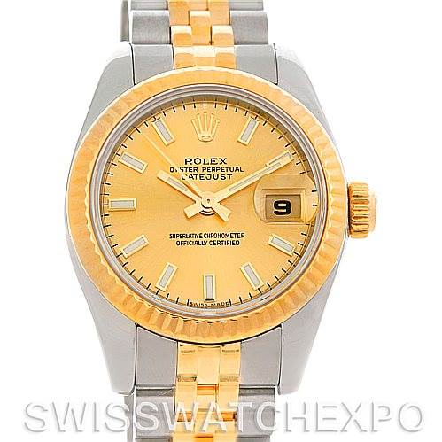 The image shows a front view of a Rolex Datejust 179173 Women's Steel and Gold (two tone) Champagne Dial 179173 Women's Steel and Gold (two tone) Champagne Dial watch, highlighting its two-tone bracelet, bezel, and gold dial with a date window.