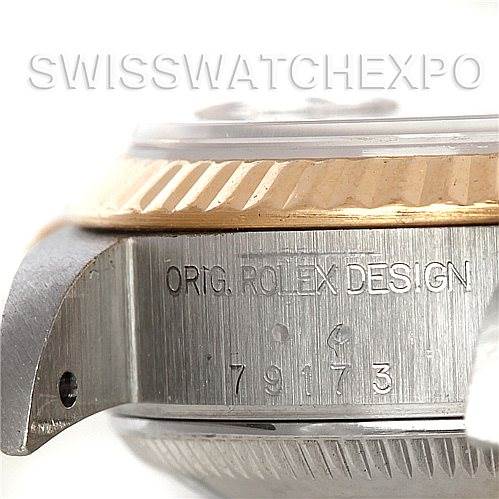 The image shows a close-up side view of a Rolex Datejust 79173 Women's Stainless Steel Blue Dial 79173 Women's Stainless Steel Blue Dial watch case, highlighting the model and design engravings.