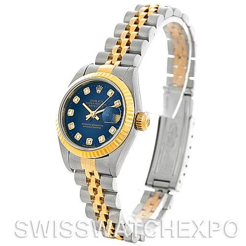 The Rolex Datejust 79173 Women's Stainless Steel Blue Dial 79173 Women's Stainless Steel Blue Dial watch is shown at a three-quarter angle, displaying the blue dial, gold bezel, and two-tone bracelet.