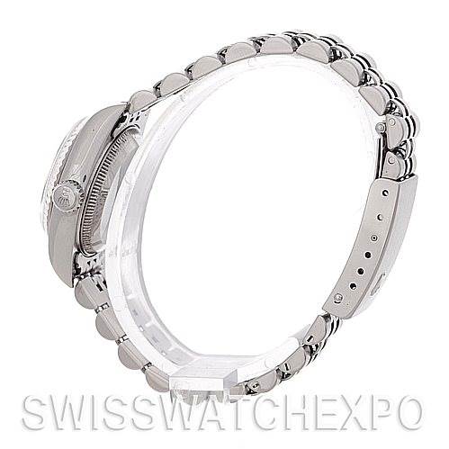 The image shows a Rolex Datejust 79174 Women's Stainless Steel Silver Dial 79174 Women's Stainless Steel Silver Dial model watch from a side angle, highlighting its bracelet and clasp.