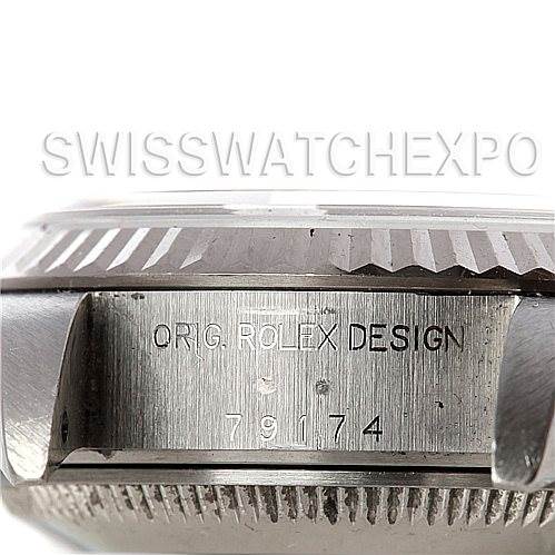 The image shows a close-up side angle of the casing of the Rolex Datejust 79174 Women's Stainless Steel Silver Dial 79174 Women's Stainless Steel Silver Dial watch, highlighting the engraving "ORIG. ROLEX DESIGN."
