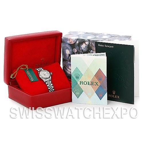 The Rolex Datejust 79174 Women's Stainless Steel Silver Dial 79174 Women's Stainless Steel Silver Dial watch is shown from a front angle, along with its box, tags, and accompanying booklets.