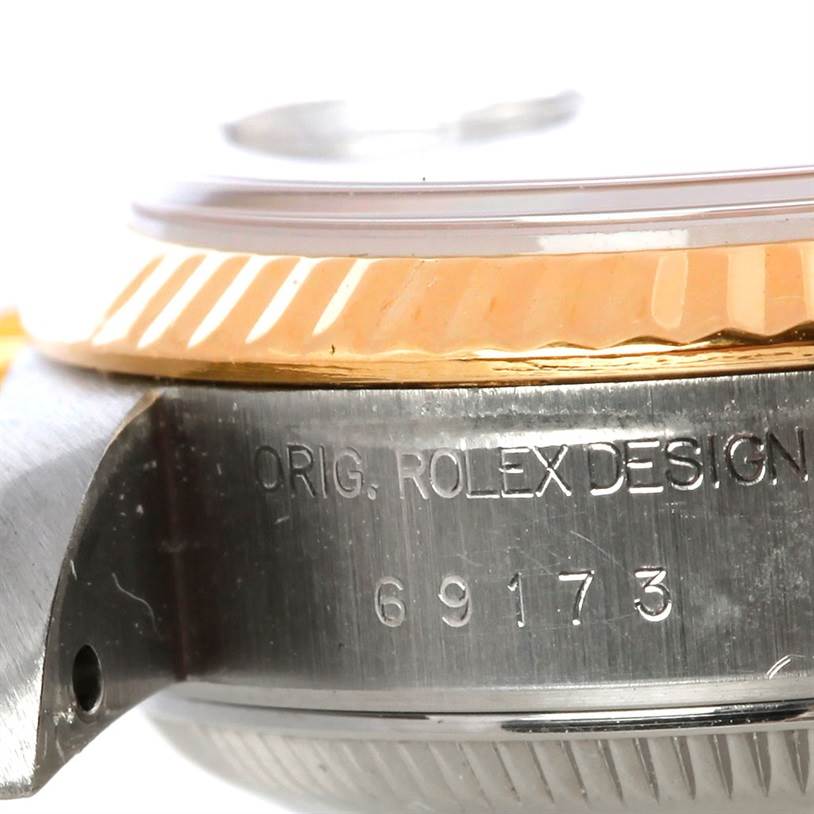 The image shows a close-up of the side of a Rolex Datejust 69173 Women's Stainless Steel Black Dial 69173 Women's Stainless Steel Black Dial watch, focusing on the model number and part of the bezel.