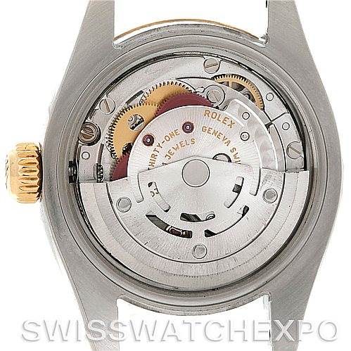 The image shows the movement and internal components of a Rolex Datejust 179173SSJ Women's Steel and Gold (two tone) Champagne Dial 179173SSJ Women's Steel and Gold (two tone) Champagne Dial watch from a back view.