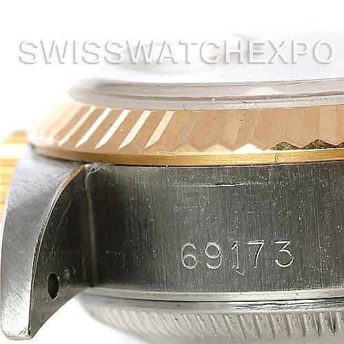 This close-up image shows the side of a Rolex Datejust 69173 Women's Stainless Steel White Dial 69173 Women's Stainless Steel White Dial model 69173, highlighting the case, serial number, and part of the bezel.