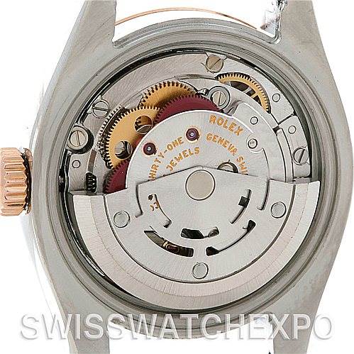 This image shows the inner mechanical movement of a Rolex Datejust 179161 Women
s Steel and Gold (two tone) White Dial 179161 Women
s Steel and Gold (two tone) White Dial watch, emphasizing the rotor and gear components.