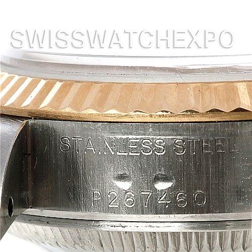 A close-up view of the side of a Rolex Datejust 79173 Women's Stainless Steel Silver Dial 79173 Women's Stainless Steel Silver Dial watch, showing the stainless steel casing and serial number engraving.