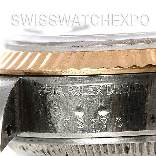 The image shows a close-up of the side of a Rolex Datejust 79173 Women's Stainless Steel Silver Dial 79173 Women's Stainless Steel Silver Dial watch, focusing on the bezel and the engraved serial number.