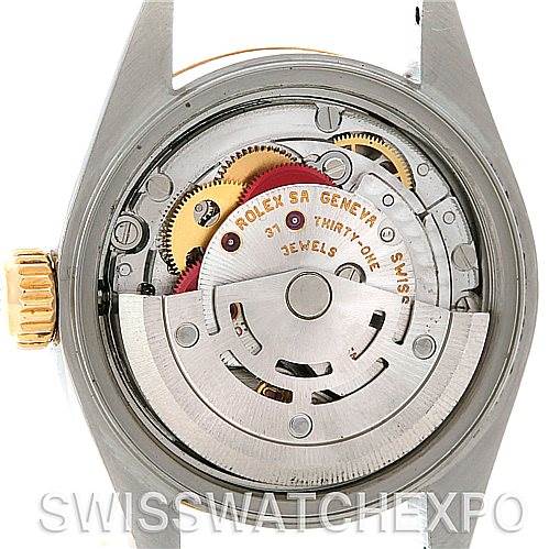 The image shows the back of a Rolex Datejust 79173 Women's Stainless Steel Silver Dial 79173 Women's Stainless Steel Silver Dial watch, revealing the internal mechanical movement and gears.